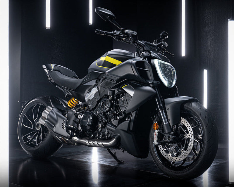 Ducati Diavel V4 Motorcycle in a dark room with illuminated cylindrical lights