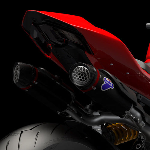 Red motorcycle with a close-up of the front wheel and engine on a black background